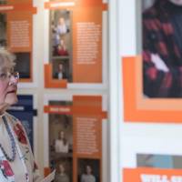 A community member reads through stories